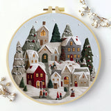 Handmade Winter Village Embroidery Hoop Wall Art – Cozy Christmas Cottage Fiber Decor